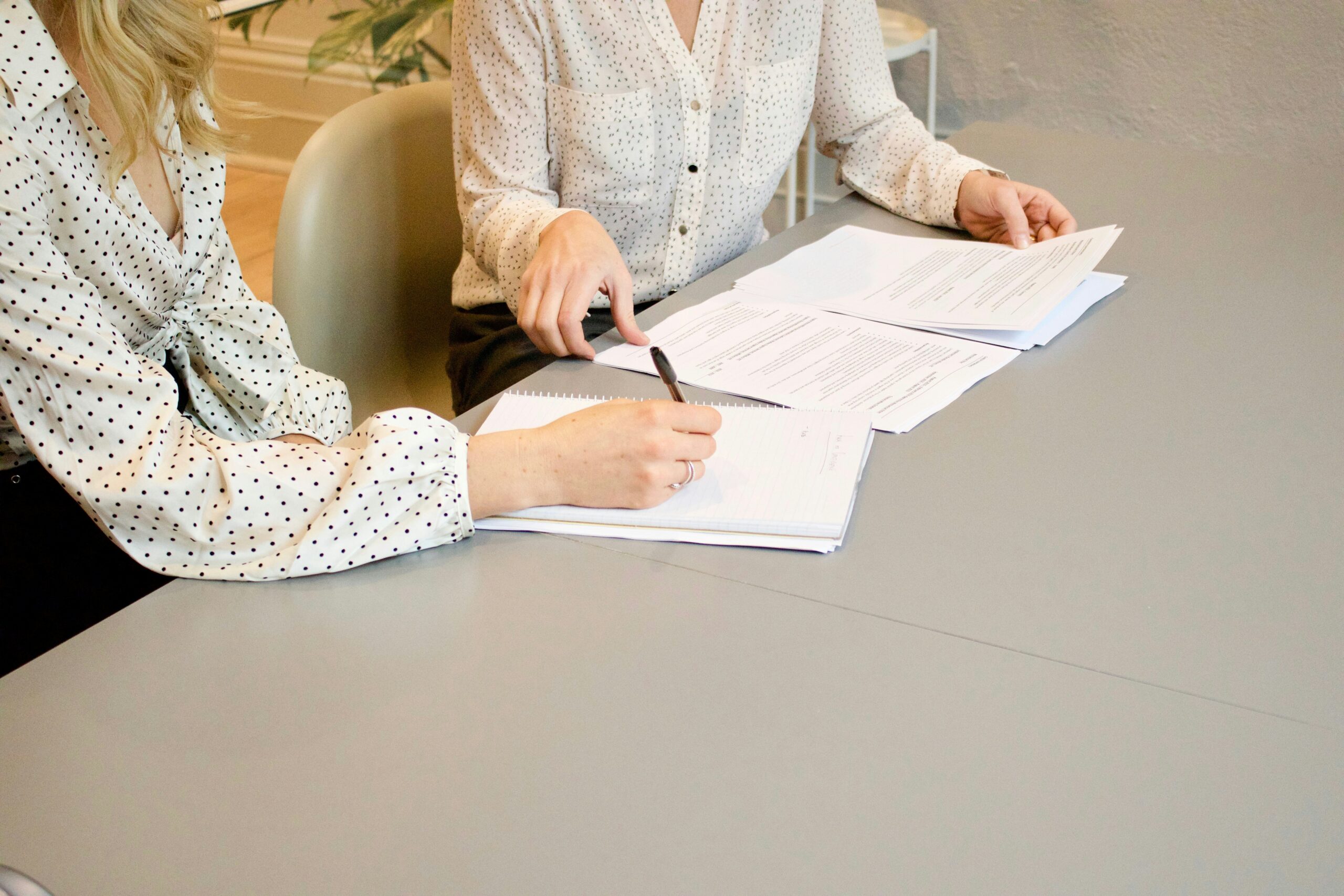 Clients reviewing financial documents with attorney